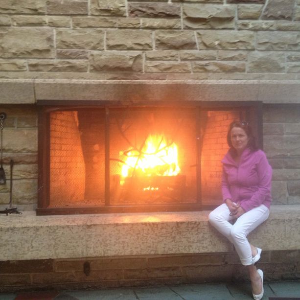 women sitting near fire 